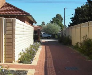 3000 litre joined beside driveway of house